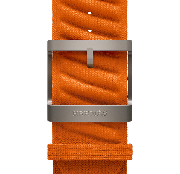 Apple Watch Hermès Ultra 3, En Mer-armband, Orange, fästen i naturlig finish, Hermès-logotypen i gravyr på spännet