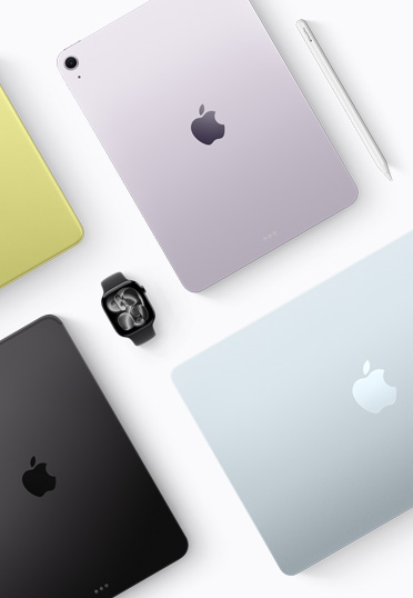 Un’immagine dall’alto di dispositivi Mac e iPad di diversi colori, con un Apple Watch nero al centro.