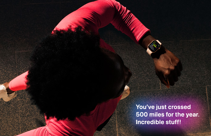 A person checks progress on Apple Watch Series 11 Workout app while running