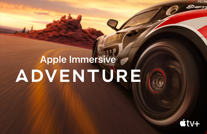 Racing car with Apple Immersive Adventure written in white letters on top