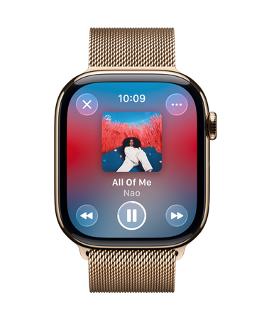 Apple Watch in Gold Titanium with Milanese loop band, face shows Apple Music playing, translucent Liquid Glass controls