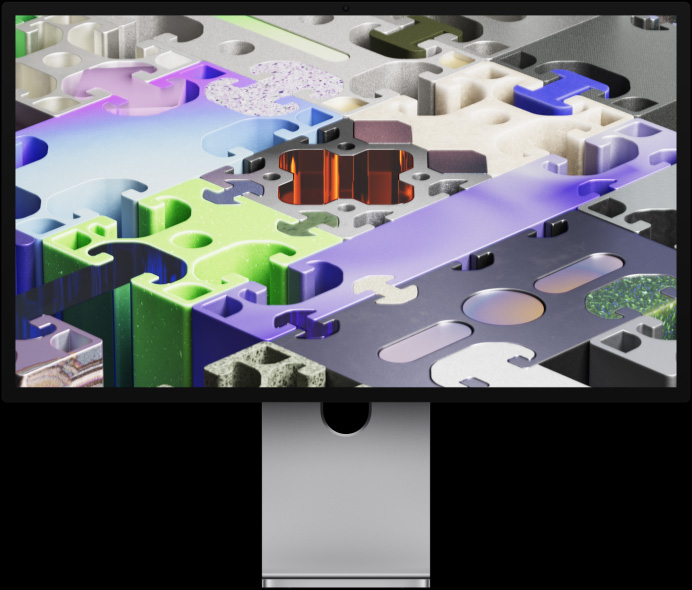 A Studio Display XDR elölnézete egy háromdimenziós kirakószerű háttérképpel